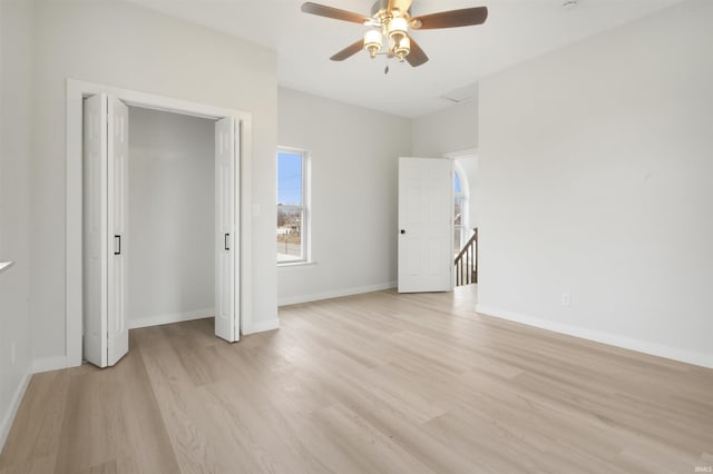 unfurnished bedroom featuring ceiling fan and light wood-type flooring