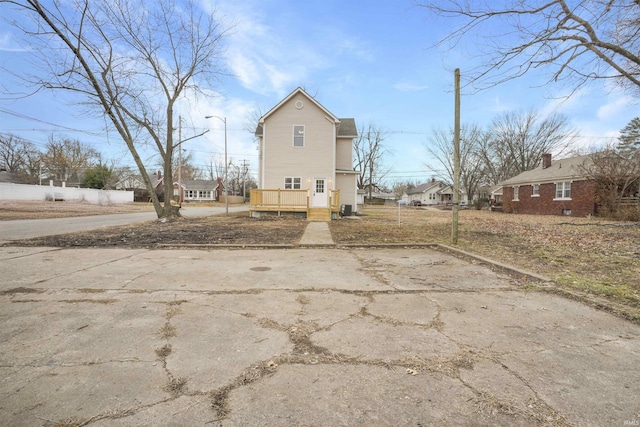 back of property featuring a deck