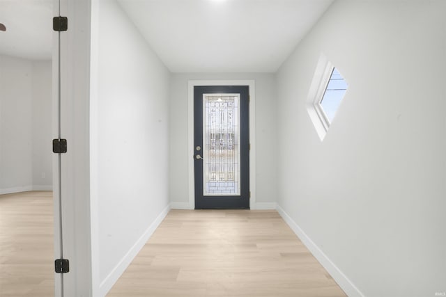 doorway to outside featuring light hardwood / wood-style flooring