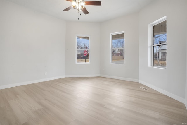 spare room featuring ceiling fan and light wood-type flooring