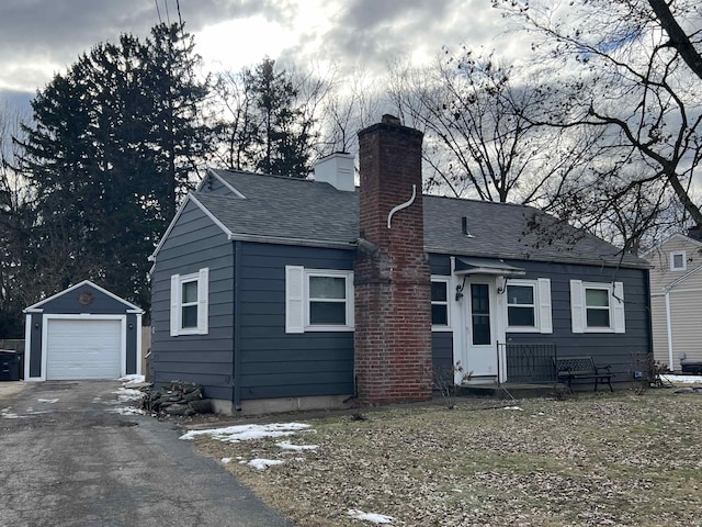 view of front of property featuring an outbuilding and a garage