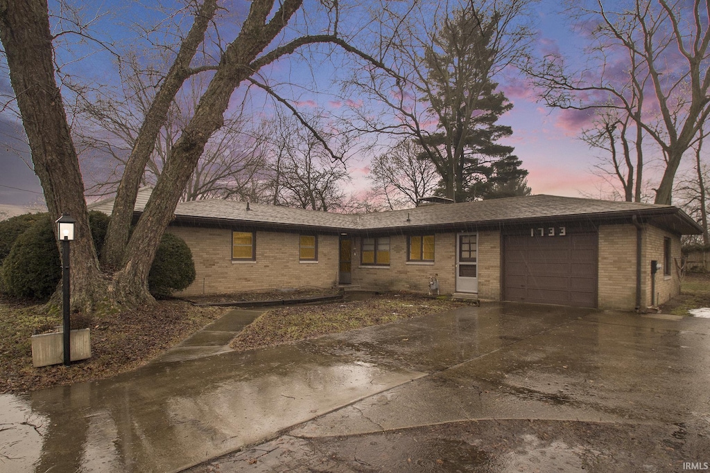 single story home featuring a garage