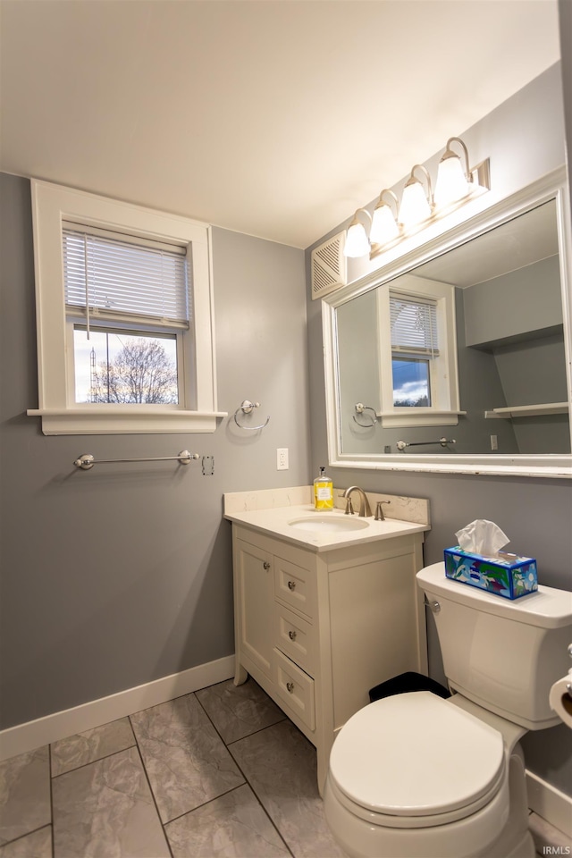 bathroom with vanity and toilet