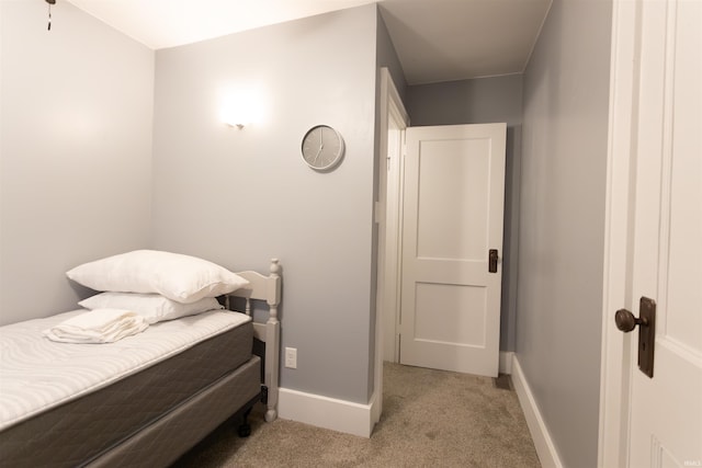 bedroom featuring light carpet