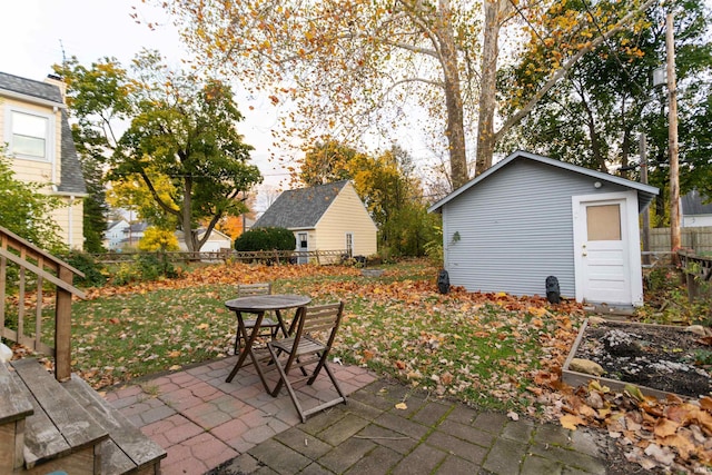 view of patio featuring a storage unit