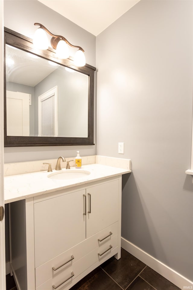 bathroom with vanity and tile patterned floors