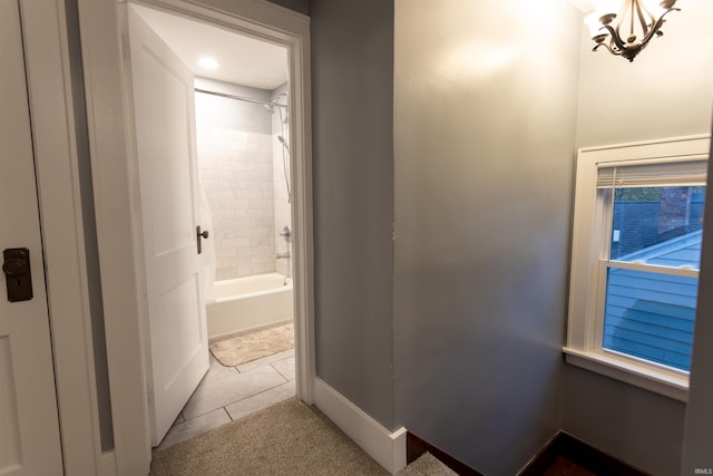 corridor with light tile patterned floors