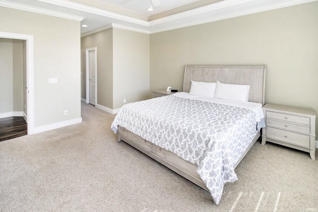 bedroom with ornamental molding and carpet