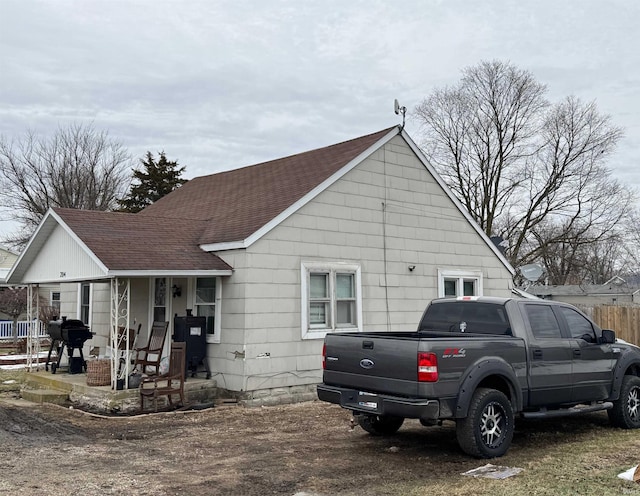 view of property exterior featuring a porch