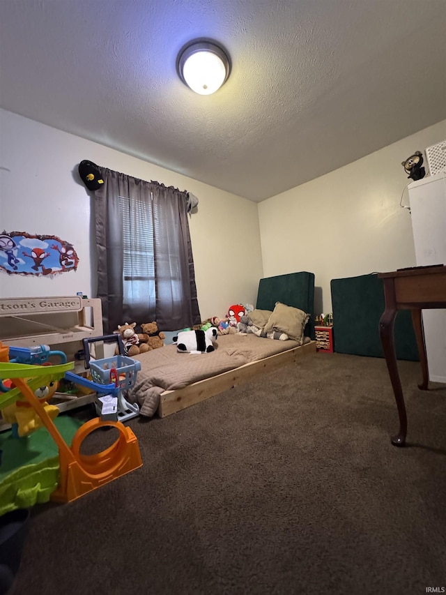 rec room with carpet flooring and a textured ceiling