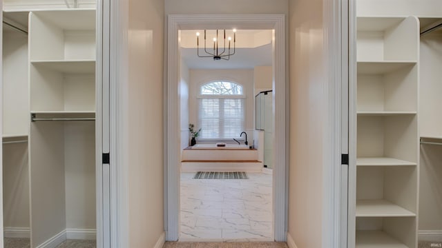 interior space with a notable chandelier and built in features