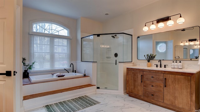 bathroom featuring plus walk in shower and vanity