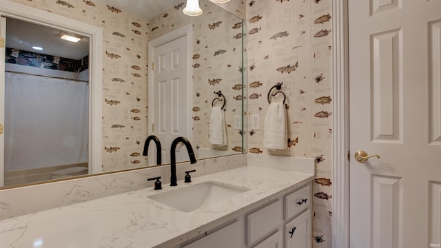 bathroom featuring vanity and a shower with shower curtain