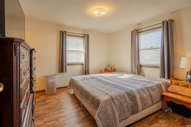 bedroom with hardwood / wood-style flooring