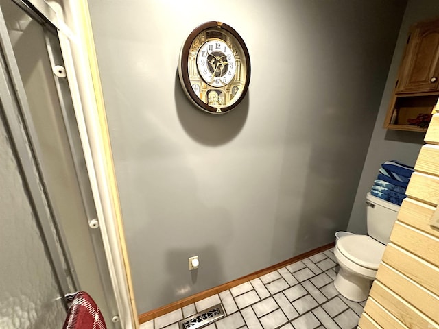 bathroom with tile patterned floors and toilet