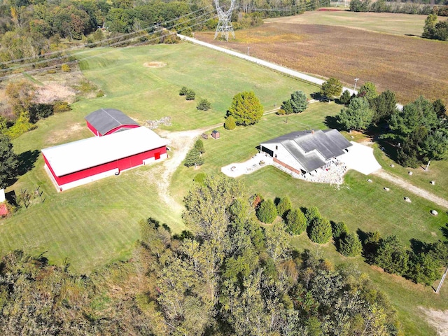 birds eye view of property with a rural view