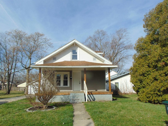 view of front of home with a front lawn and a porch