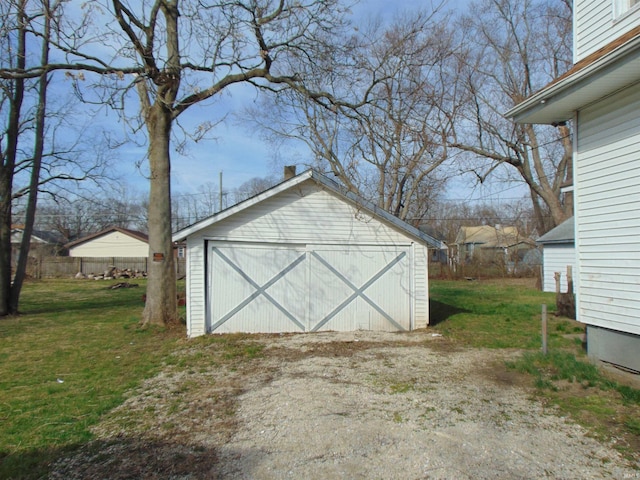 garage featuring a yard