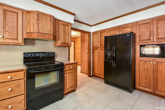 kitchen with ornamental molding, custom range hood, and black appliances