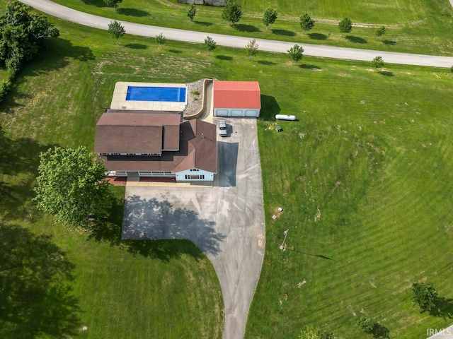 birds eye view of property with a rural view