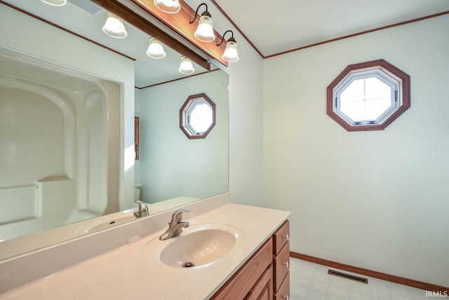 bathroom with vanity and crown molding