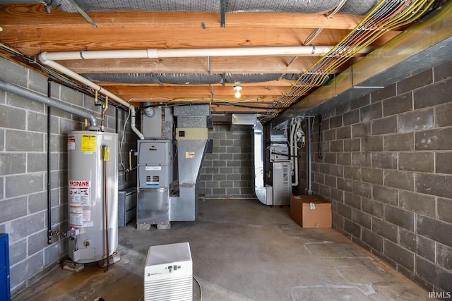 basement featuring heating unit and gas water heater