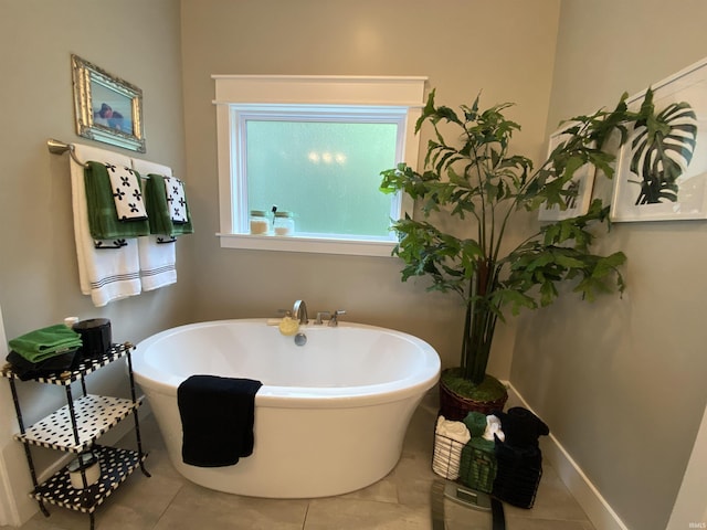 bathroom featuring a bathing tub and tile patterned flooring