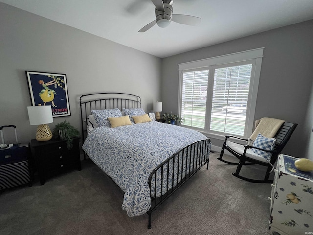 bedroom with ceiling fan and dark carpet