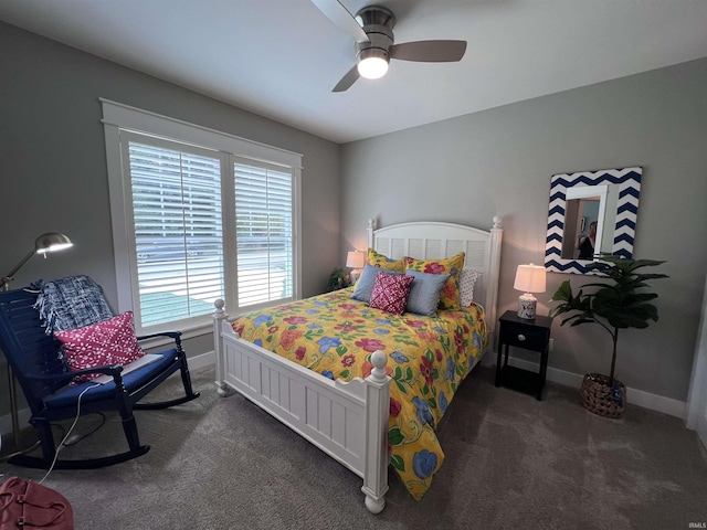 bedroom featuring dark carpet and ceiling fan