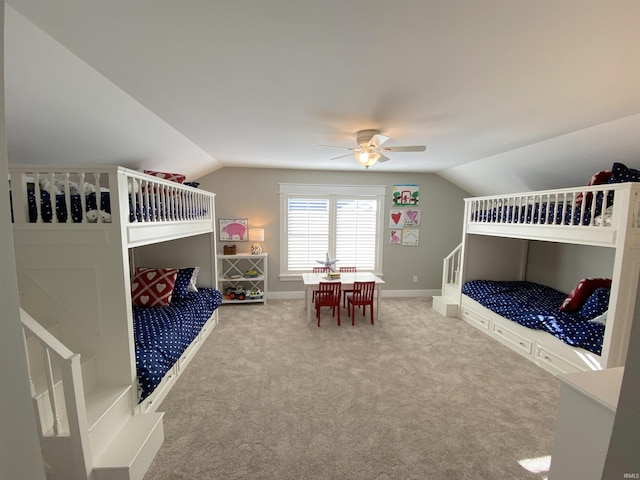 bedroom featuring vaulted ceiling, carpet floors, and ceiling fan