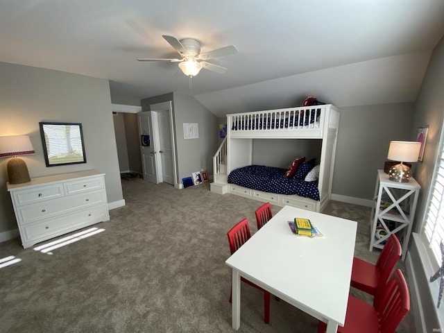 carpeted bedroom with vaulted ceiling and ceiling fan