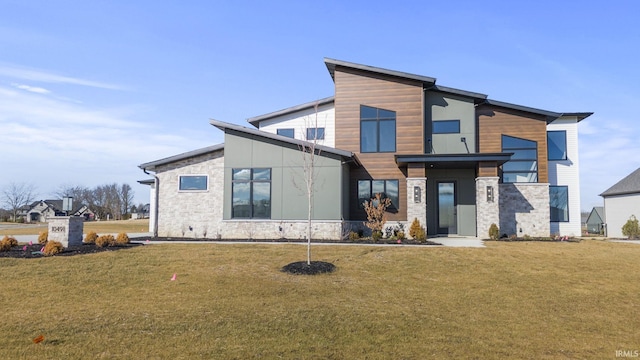 modern home with a front lawn