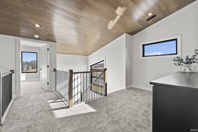 hallway with crown molding, a wealth of natural light, light carpet, and wooden ceiling