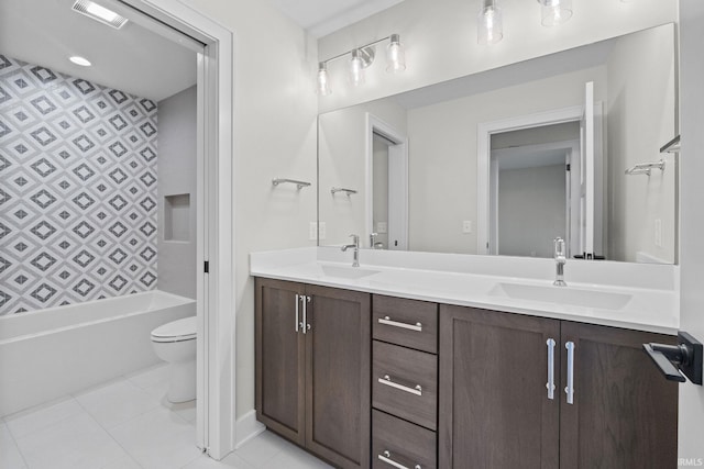 full bathroom with tile patterned floors, vanity, toilet, and washtub / shower combination