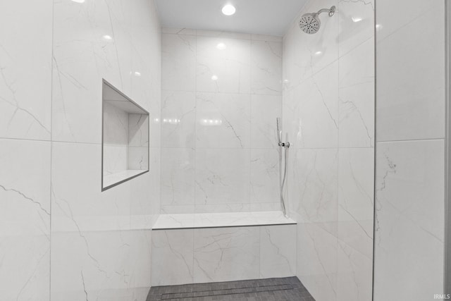 bathroom with a tile shower