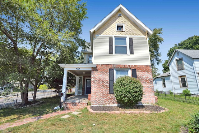 view of front of home with a porch and a front yard