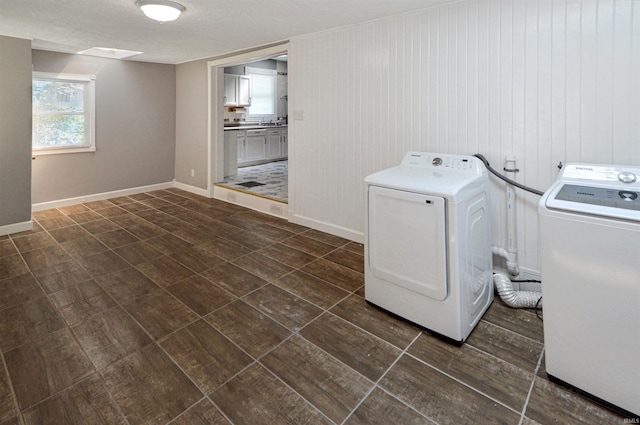 laundry area with separate washer and dryer