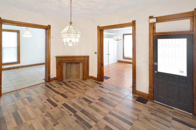 foyer entrance featuring an inviting chandelier