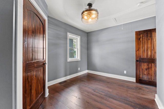 empty room featuring dark hardwood / wood-style floors