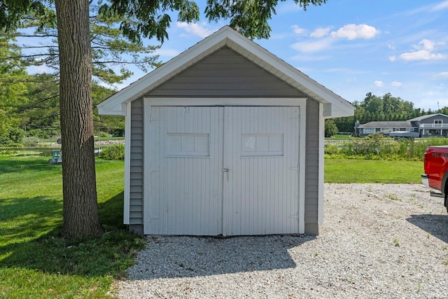 view of outdoor structure with a lawn