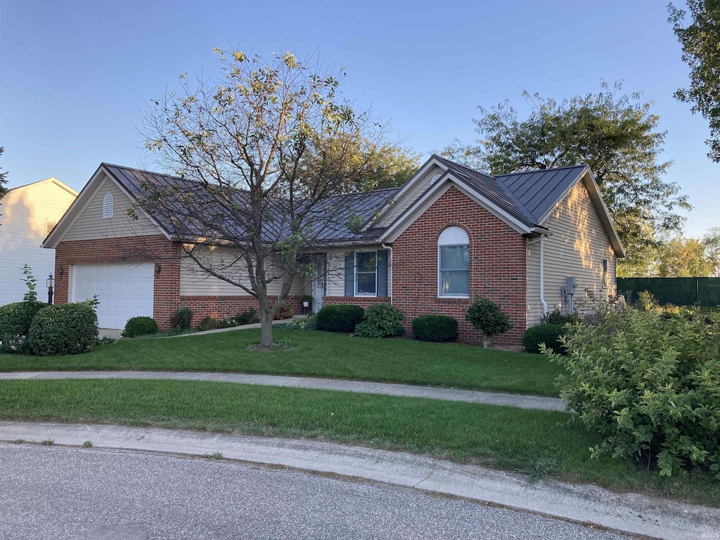 ranch-style house with a garage and a front yard