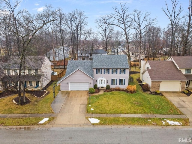 view of front of home featuring a garage and a front yard