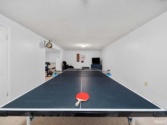 rec room with a textured ceiling