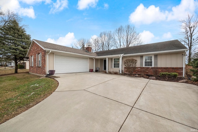 ranch-style home featuring a garage and a front lawn