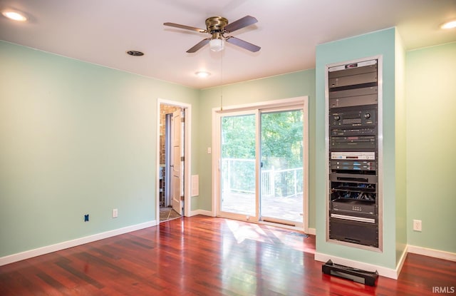 empty room featuring ceiling fan and hardwood / wood-style floors