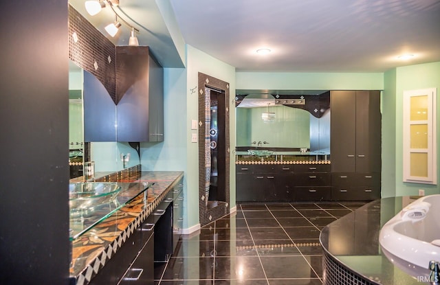 kitchen featuring dark tile patterned flooring