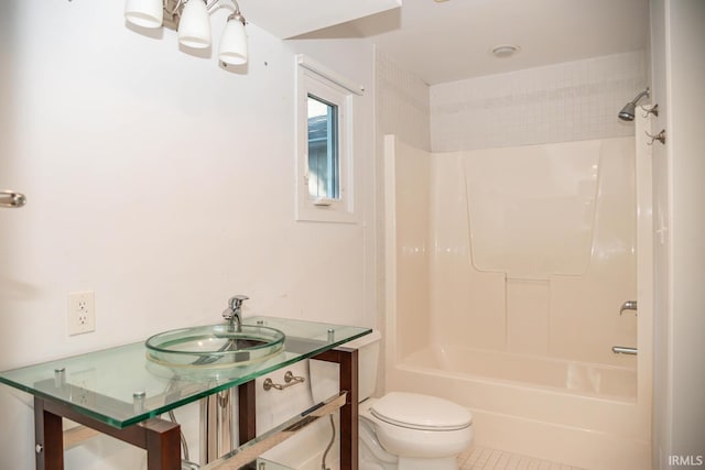 full bathroom featuring bathtub / shower combination, tile patterned floors, toilet, and sink