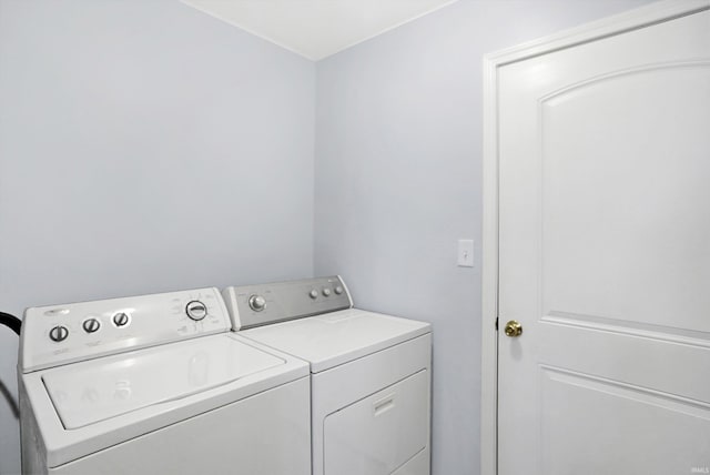 washroom featuring independent washer and dryer