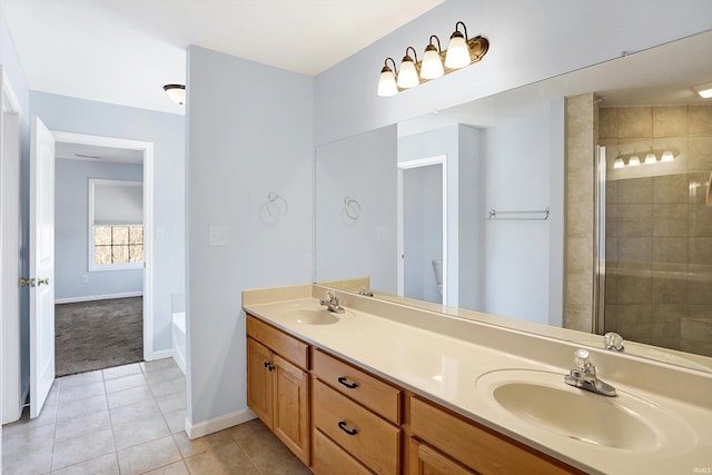 full bathroom with vanity, tile patterned floors, independent shower and bath, and toilet