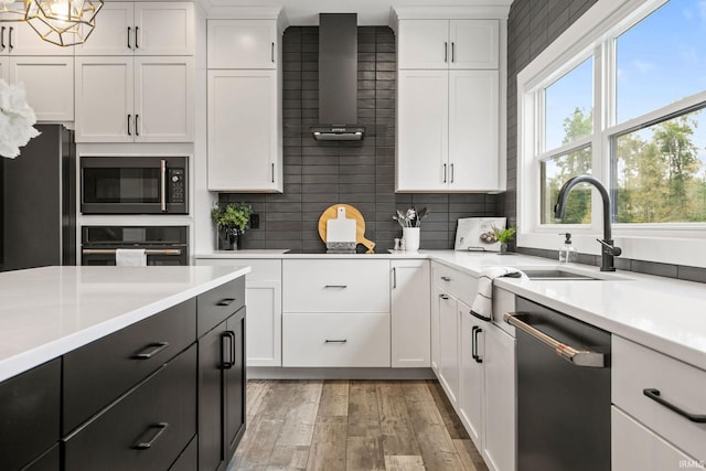 kitchen with white cabinetry and stainless steel appliances